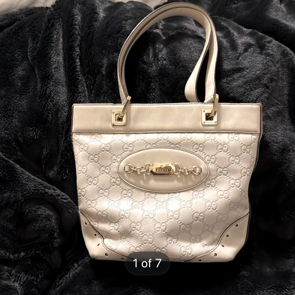 Authentic Gucci Guccissima Punch Tote Bag in white.